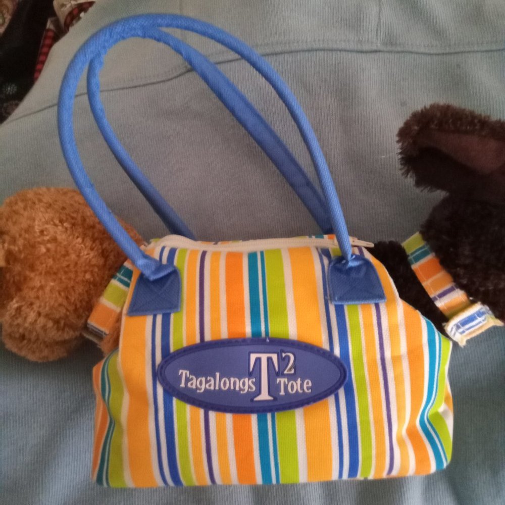 Tagalong Tote 2 puppies Golden Retriever and brown Labrador retriever inside bag